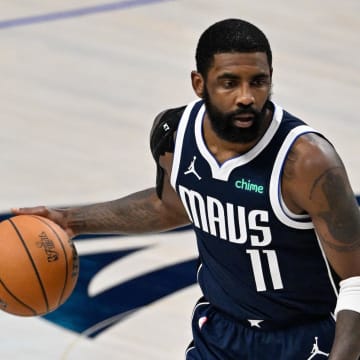 Jun 14, 2024; Dallas, Texas, USA; Dallas Mavericks guard Kyrie Irving (11) dribbles against the Boston Celtics during the second half of game four of the 2024 NBA Finals at American Airlines Center. Mandatory Credit: Jerome Miron-USA TODAY Sports