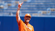 Associate head coach Steve Singleton pitches while the Texas softball team takes the field during the practice and media day for the Women's College World Series at Devon Park in Oklahoma City, on Wednesday, May 29, 2024.