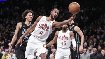 Feb 8, 2024; Brooklyn, New York, USA;  Cleveland Cavaliers forward Evan Mobley (4) grabs a loose ball against the Nets. 