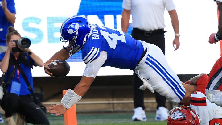 Sep 5, 2026; Provo, Utah, USA;  BYU Cougars quarterback Bear Bachmeier (47) dives for a touchdown against Utah Tech Trailblazers defensive lineman Fasitootai Sagapolu (3) during the second quarter at LaVell Edwards Stadium.  Mandatory Credit: Rob Gray-Imagn Images