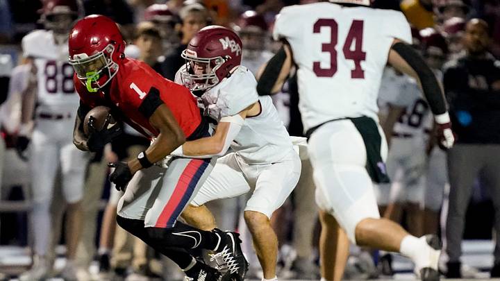 Brentwood Academy's Kesean Bowman (1) is stopped by MBA’s Graham Geshke (6) during the first quarter at Brentwood Academy in Nashville, Tenn., Friday, Nov. 14, 2025.