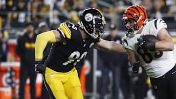 Dec 23, 2023; Pittsburgh, Pennsylvania, USA; Cincinnati Bengals tight end Drew Sample (89) runs after a catch as Pittsburgh Steelers linebacker T.J. Watt (90) defends during the second quarter at Acrisure Stadium. Mandatory Credit: Charles LeClaire-Imagn Images