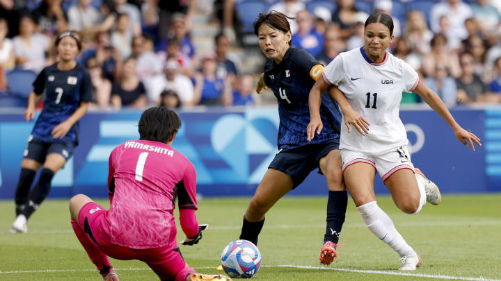 Aug 3, 2024; Paris, France; Japan goalkeeper Ayaka Yamashita (1), Japan defender Saki Kumagai (4) and United States forward Sophia Smith (11) during the Paris 2024 Olympic Summer Games at Parc des Princes. Mandatory Credit: Yukihito Taguchi-USA TODAY Sports