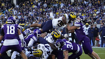 Nov 15, 2025; Chicago, Illinois, USA; Michigan Wolverines running back Jordan Marshall (23) runs for a touchdown against the Northwestern Wildcats  during the second half at Wrigley Field. Mandatory Credit: David Banks-Imagn Images