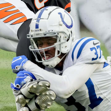 Indianapolis Colts cornerback Ameer Speed (37) works to bring down Cincinnati Bengals wide receiver Charlie Jones (15) on Sunday, Dec. 10, 2023, during a game against the Cincinnati Bengals at Paycor Stadium in Cincinnati.
