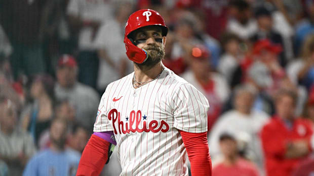 Philadelphia Phillies first baseman Bryce Harper (3) reacts to striking out