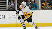 Jan 27, 2025; San Jose, California, USA;  Pittsburgh Penguins left winger Michael Bunting (8) controls the puck during the first period against the San Jose Sharks at SAP Center at San Jose. Mandatory Credit: David Gonzales-Imagn Images