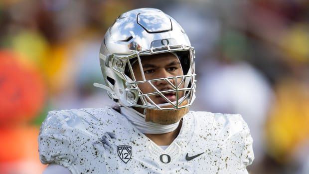 Nov 18, 2023; Tempe, Arizona, USA; Oregon Ducks offensive lineman Dave Iuli (52) against the Arizona State Sun Devils at Moun