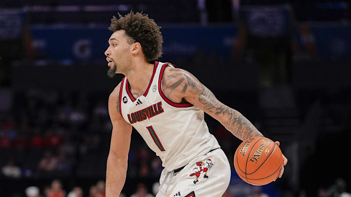 Mar 14, 2025; Charlotte, NC, USA; Louisville Cardinals guard J'Vonne Hadley (1) handles the ball against Clemson Tigers forward Ian Schieffelin (4) during the second half at Spectrum Center. Mandatory Credit: Jim Dedmon-Imagn Images Mar 14, 2025; Charlotte, NC, USA; Louisville Cardinals guard J'Vonne Hadley (1) handles the ball against Clemson Tigers forward Ian Schieffelin (4) during the second half at Spectrum Center. Mandatory Credit: Jim Dedmon-Imagn Images
