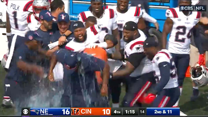 The New England Patriots celebrate a win by throwing Gatorade on coach Jerod Mayo.