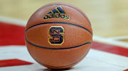 Feb 20, 2019; Raleigh, NC, USA; Basketball with the North Carolina State Wolfpack logo sits on the court during a timeout as the Wolfpack play the Boston College Eagles in the first half at PNC Arena. The North Carolina State Wolfpack won 89-80. Mandatory Credit: Nell Redmond-Imagn Images
