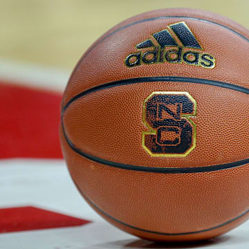 Feb 20, 2019; Raleigh, NC, USA; Basketball with the North Carolina State Wolfpack logo sits on the court during a timeout as the Wolfpack play the Boston College Eagles in the first half at PNC Arena. The North Carolina State Wolfpack won 89-80. Mandatory Credit: Nell Redmond-Imagn Images