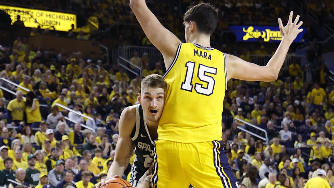 Mar 8, 2026; Ann Arbor, Michigan, USA;  Michigan State Spartans center Carson Cooper (15) is defended by Michigan Wolverines center Aday Mara (15) in the second half at Crisler Center. Mandatory Credit: Rick Osentoski-Imagn Images