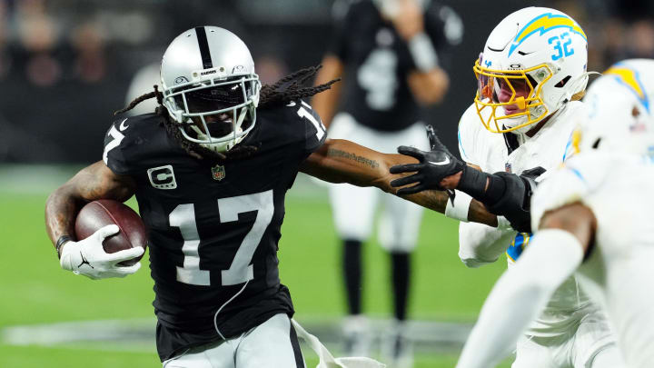 Dec 14, 2023; Paradise, Nevada, USA; Las Vegas Raiders wide receiver Davante Adams (17) runs against Los Angeles Chargers safety Alohi Gilman (32) in the first quarter at Allegiant Stadium. Mandatory Credit: Stephen R. Sylvanie-USA TODAY Sports