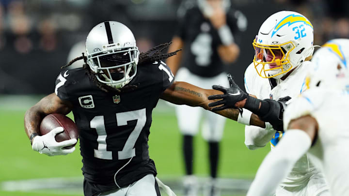 Dec 14, 2023; Paradise, Nevada, USA; Las Vegas Raiders wide receiver Davante Adams (17) runs against Los Angeles Chargers safety Alohi Gilman (32) in the first quarter at Allegiant Stadium. Mandatory Credit: Stephen R. Sylvanie-Imagn Images