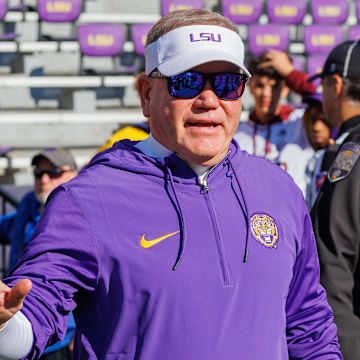 Nov 25, 2023; Baton Rouge, Louisiana, USA;  LSU Tigers head coach Brian Kelly waves to fans during warmups before the game against the Texas A&M Aggies at Tiger Stadium. Mandatory Credit: Stephen Lew-Imagn Images