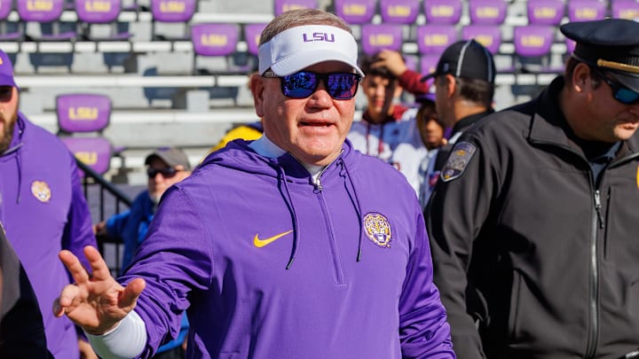 Nov 25, 2023; Baton Rouge, Louisiana, USA;  LSU Tigers head coach Brian Kelly waves to fans during warmups before the game against the Texas A&M Aggies at Tiger Stadium. Mandatory Credit: Stephen Lew-Imagn Images