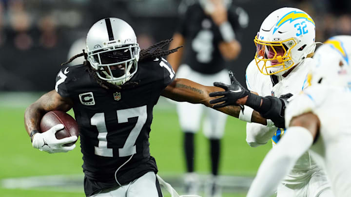 Dec 14, 2023; Paradise, Nevada, USA; Las Vegas Raiders wide receiver Davante Adams (17) runs against Los Angeles Chargers safety Alohi Gilman (32) in the first quarter at Allegiant Stadium. Mandatory Credit: Stephen R. Sylvanie-Imagn Images Dec 14, 2023; Paradise, Nevada, USA; Las Vegas Raiders wide receiver Davante Adams (17) runs against Los Angeles Chargers safety Alohi Gilman (32) in the first quarter at Allegiant Stadium. Mandatory Credit: Stephen R. Sylvanie-Imagn Images
