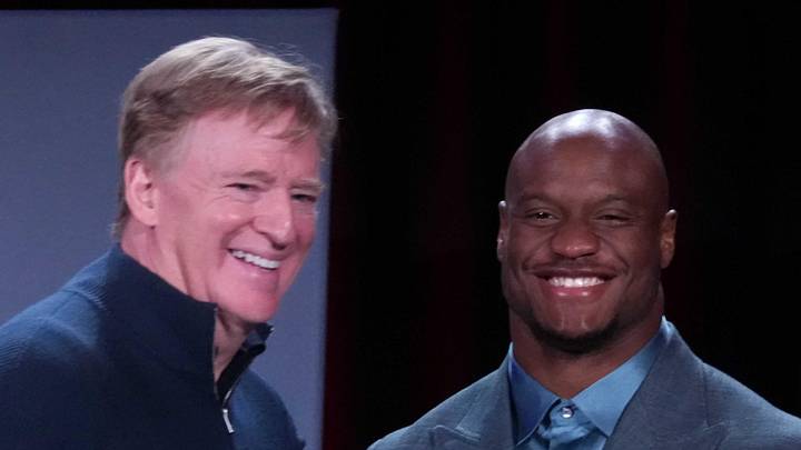 NFL commissioner Roger Goodell presents Seattle Seahawks running back Kenneth Walker III with the MVP trophy