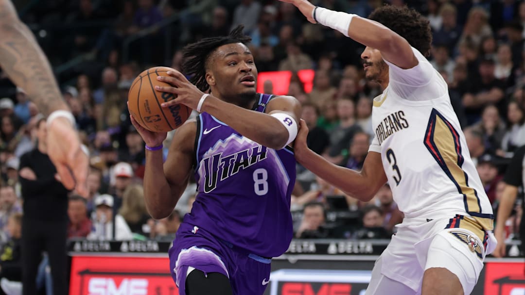 Feb 28, 2026; Salt Lake City, Utah, USA;  Utah Jazz guard Isaiah Collier (8) tries to get past New Orleans Pelicans guard Jordan Poole (3) and to the basket during the second half at Delta Center. Mandatory Credit: Chris Nicoll-Imagn Images