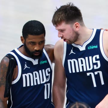 Jun 14, 2024; Dallas, Texas, USA; Dallas Mavericks guard Kyrie Irving (11) reacts with Dallas Mavericks guard Luka Doncic (77) during the second half against the Boston Celtics during game four of the 2024 NBA Finals at American Airlines Center. Mandatory Credit: Kevin Jairaj-USA TODAY Sports