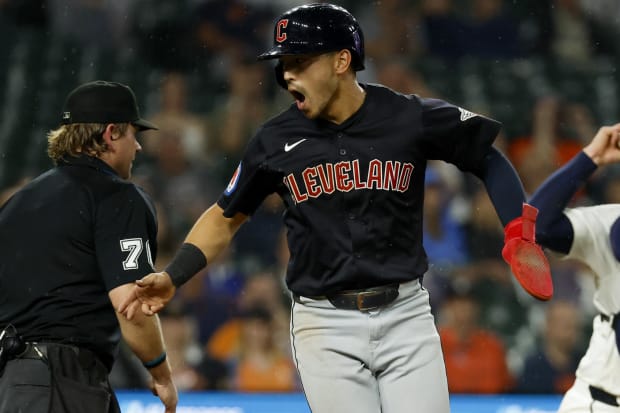 Steven Kwan celebrates after scorin