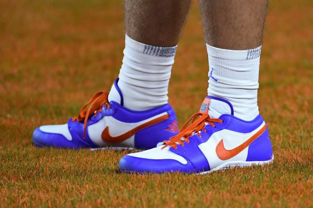 Blue and orange Air Jordan cleats.