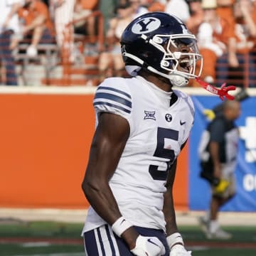 Oct 28, 2023; Austin, Texas, USA; Brigham Young Cougars wide receiver Darius Lassiter (5) reacts after drawing a penalty from Texas Longhorns defenders during the second half at Darrell K Royal-Texas Memorial Stadium. 