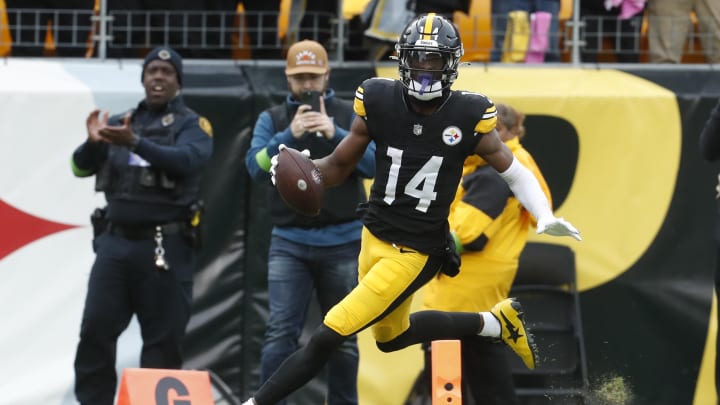 Oct 8, 2023; Pittsburgh, Pennsylvania, USA;  Pittsburgh Steelers wide receiver George Pickens (14) crosses the goal line to score a touchdown against the Baltimore Ravens during the fourth quarter at Acrisure Stadium. Mandatory Credit: Charles LeClaire-USA TODAY Sports