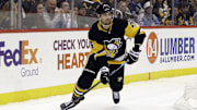 Feb 14, 2020; Pittsburgh, Pennsylvania, USA;  Pittsburgh Penguins defenseman Justin Schultz (4) moves the puck against the Montreal Canadiens during the third period at PPG PAINTS Arena. The Penguins won 4-1. Mandatory Credit: Charles LeClaire-Imagn Images