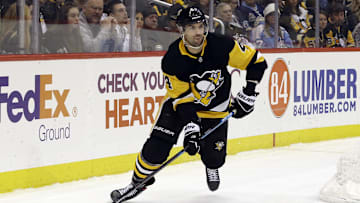 Feb 14, 2020; Pittsburgh, Pennsylvania, USA;  Pittsburgh Penguins defenseman Justin Schultz (4) moves the puck against the Montreal Canadiens during the third period at PPG PAINTS Arena. The Penguins won 4-1. Mandatory Credit: Charles LeClaire-Imagn Images