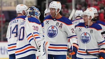 Jun 12, 2025; Sunrise, Florida, USA; Edmonton Oilers defenseman Darnell Nurse (25) celebrates the win with goaltender Calvin Pickard (30) after overtime against the Florida Panthers in game four of the 2025 Stanley Cup Final at Amerant Bank Arena. Mandatory Credit: Jim Rassol-Imagn Images