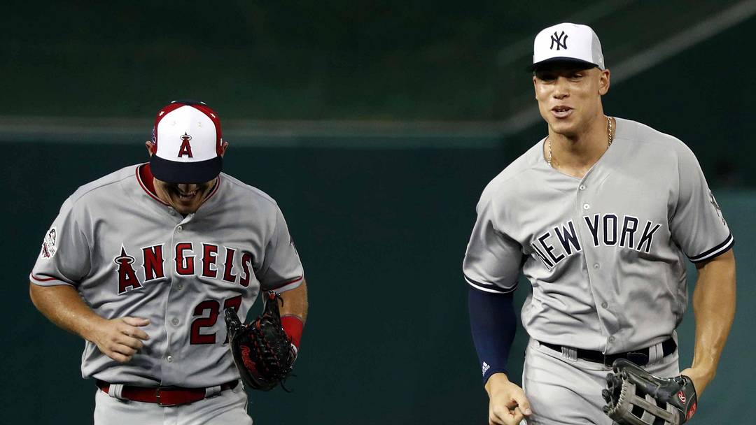 Jul 17, 2018; Washington, DC, USA; American League outfielder Aaron Judge of the New York Yankees (99) and American League outfielder Mike Trout of the Los Angeles Angels (27) run to the dug out after the first inning in the 2018 MLB All Star Game at Nationals Ballpark. Mandatory Credit: Geoff Burke-Imagn Images Jul 17, 2018; Washington, DC, USA; American League outfielder Aaron Judge of the New York Yankees (99) and American League outfielder Mike Trout of the Los Angeles Angels (27) run to the dug out after the first inning in the 2018 MLB All Star Game at Nationals Ballpark. Mandatory Credit: Geoff Burke-Imagn Images
