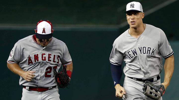 Jul 17, 2018; Washington, DC, USA; American League outfielder Aaron Judge of the New York Yankees (99) and American League outfielder Mike Trout of the Los Angeles Angels (27) run to the dug out after the first inning in the 2018 MLB All Star Game at Nationals Ballpark. Mandatory Credit: Geoff Burke-Imagn Images
