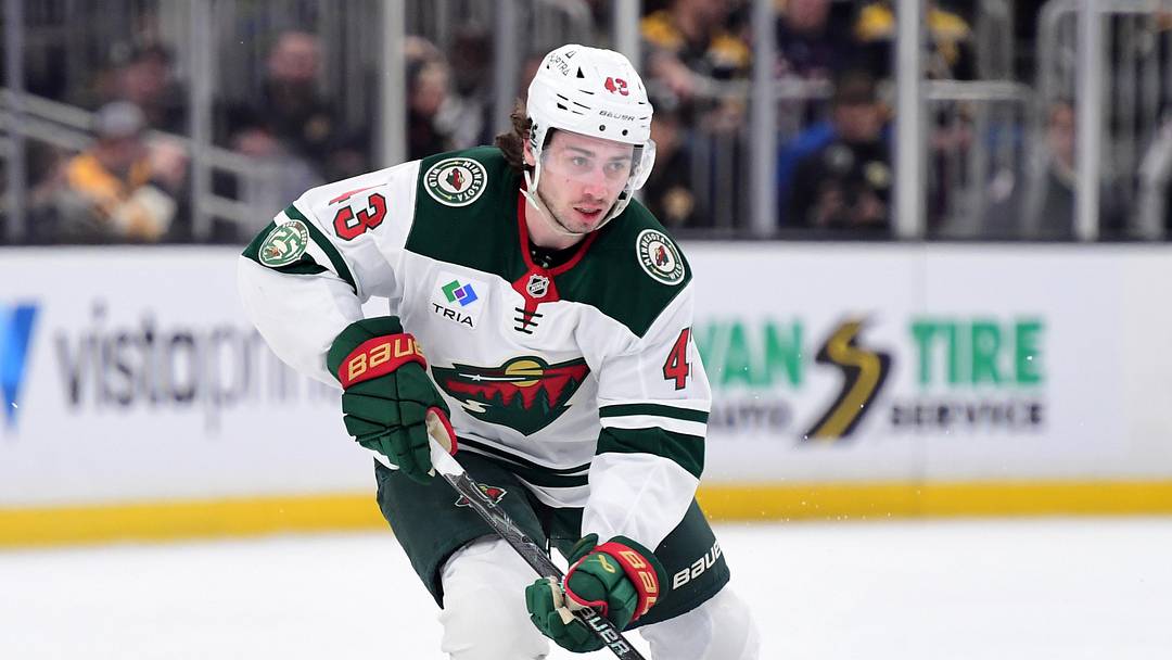 Mar 28, 2026; Boston, Massachusetts, USA; Minnesota Wild defenseman Quinn Hughes (43) skates with the puck during the second period against the Boston Bruins at TD Garden. Mandatory Credit: Bob DeChiara-Imagn Images