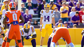 Oct 16, 2021; Baton Rouge, Louisiana, USA;  LSU Tigers quarterback Max Johnson (14) looks over the Florida Gators defense during the first half  at Tiger Stadium. Mandatory Credit: Stephen Lew-Imagn Images