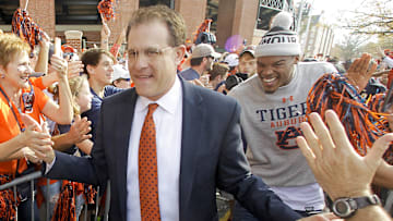 Nov 28, 2015; Auburn, AL, USA; Auburn Tigers head coach Gus Malzahn is followed by former Auburn Tigers player and current Carolina Panthers quarterback Cam Newton during Tiger Walk prior to the game against Alabama Crimson Tide at Jordan Hare Stadium. Mandatory Credit: John Reed-Imagn Images