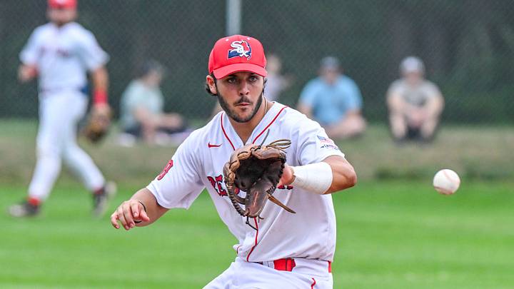 Y-D third baseman Chris Hacopian fields a ball hit by Matt Conte of Harwich. Cape League baseball
July 17 2025