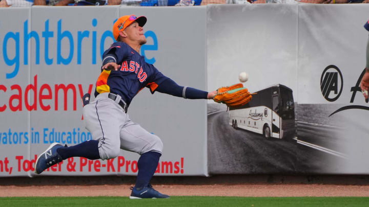 Mar 3, 2024; Port St. Lucie, Florida, USA; Houston Astros center fielder Kenedy Corona (89) makes a lunging catch in foul territory against the New York Mets in the third inning at Clover Park. 