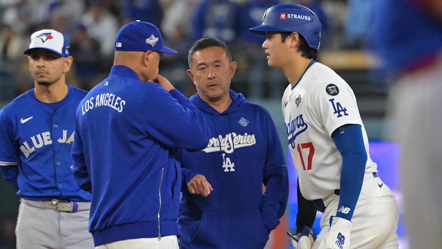 Los Angeles Dodgers manager Dave Roberts meets with Shohei Ohtani.