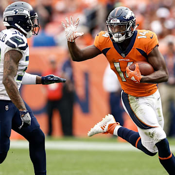 Sep 9, 2018; Denver, CO, USA; Denver Broncos wide receiver Courtland Sutton (14) runs the ball against Seattle Seahawks strong safety Bradley McDougald (30) in the fourth quarter at Broncos Stadium at Mile High. 