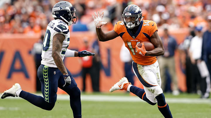 Sep 9, 2018; Denver, CO, USA; Denver Broncos wide receiver Courtland Sutton (14) runs the ball against Seattle Seahawks strong safety Bradley McDougald (30) in the fourth quarter at Broncos Stadium at Mile High. 