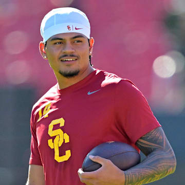 Oct 11, 2025; Los Angeles, California, USA;  USC Trojans quarterback Jayden Maiava (14) warms up prior to the game against the Michigan Wolverines at United Airlines Field at the Los Angeles Memorial Coliseum. Mandatory Credit: Jayne Kamin-Oncea-Imagn Images