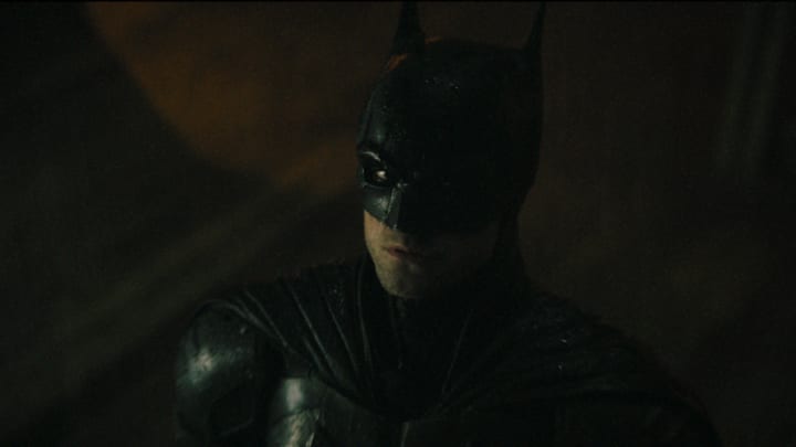 ROBERT PATTINSON as Batman in Warner Bros. Pictures’ action adventure “THE BATMAN,” a Warner Bros. Pictures release. Courtesy of Warner Bros. Pictures/ ™ & © DC Comics. Pictures release. © 2021 Warner Bros. Entertainment Inc. All Rights Reserved.