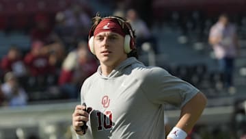 Nov 15, 2025; Tuscaloosa, Alabama, USA; Oklahoma quarterback John Mateer (10) jobs to loosen up before the game with Alabama at Saban Field at Bryant-Denny Stadium at Saban Field at Bryant-Denny Stadium