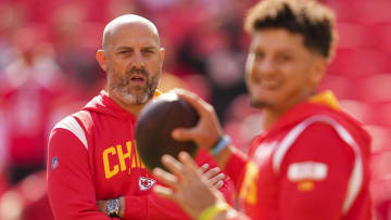 Oct 16, 2022; Kansas City, Missouri, USA; Kansas City Chiefs quarterback coach Matt Nagy watches as quarterback Patrick Mahomes (15) warms up prior to a game against the Buffalo Bills at GEHA Field at Arrowhead Stadium. Mandatory Credit: Jay Biggerstaff-USA TODAY Sports