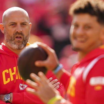 Oct 16, 2022; Kansas City, Missouri, USA; Kansas City Chiefs quarterback coach Matt Nagy watches as quarterback Patrick Mahomes (15) warms up prior to a game against the Buffalo Bills at GEHA Field at Arrowhead Stadium. Mandatory Credit: Jay Biggerstaff-USA TODAY Sports