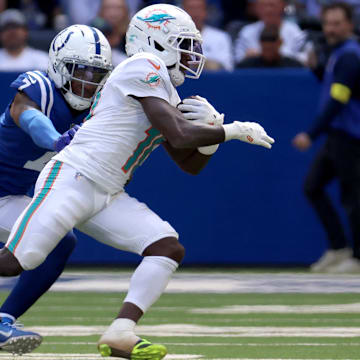 Sep 7, 2025; Indianapolis, Indiana, USA; Miami Dolphins wide receiver Tyreek Hill (10) runs against Indianapolis Colts cornerback Charvarius Ward (7) during the second half at Lucas Oil Stadium. Mandatory Credit: Trevor Ruszkowski-Imagn Images