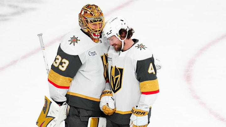 Mar 14, 2026; Las Vegas, Nevada, USA; Vegas Golden Knights defenseman Rasmus Andersson (4) congratulates goaltender Adin Hill (33) after the Golden Knights defeated the Chicago Blackhawks 4-0 at T-Mobile Arena. Mandatory Credit: Stephen R. Sylvanie-Imagn Images