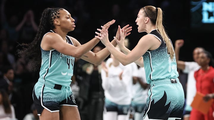 Jun 2, 2024; Brooklyn, New York, USA; New York Liberty forward Betnijah Laney-Hamilton (44) and guard Sabrina Ionescu (20) celebrate after the Indiana Fever call a timeout in the first quarter at Barclays Center. Mandatory Credit: Wendell Cruz-Imagn Images Jun 2, 2024; Brooklyn, New York, USA; New York Liberty forward Betnijah Laney-Hamilton (44) and guard Sabrina Ionescu (20) celebrate after the Indiana Fever call a timeout in the first quarter at Barclays Center. Mandatory Credit: Wendell Cruz-Imagn Images